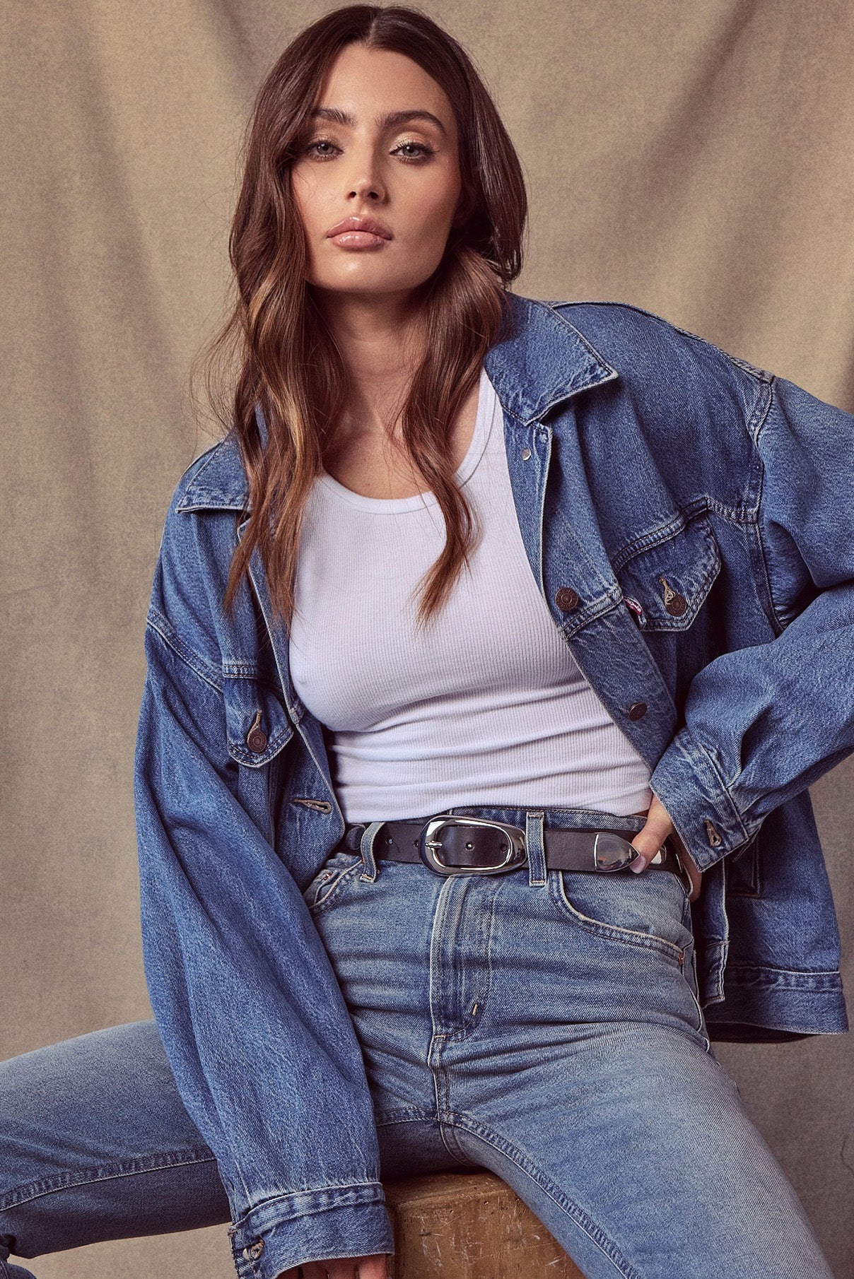 Model wearing the Blake black leather belt with silver studs at the waist.