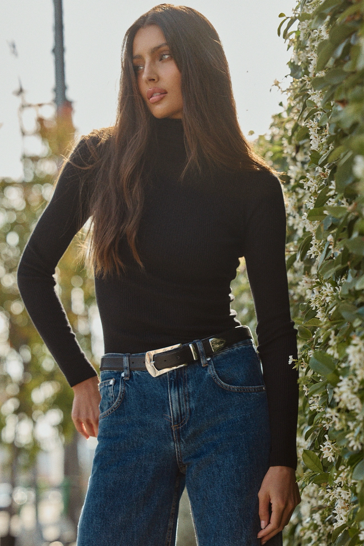 Model wearing the Knox pebbled black leather belt styled at the waist.