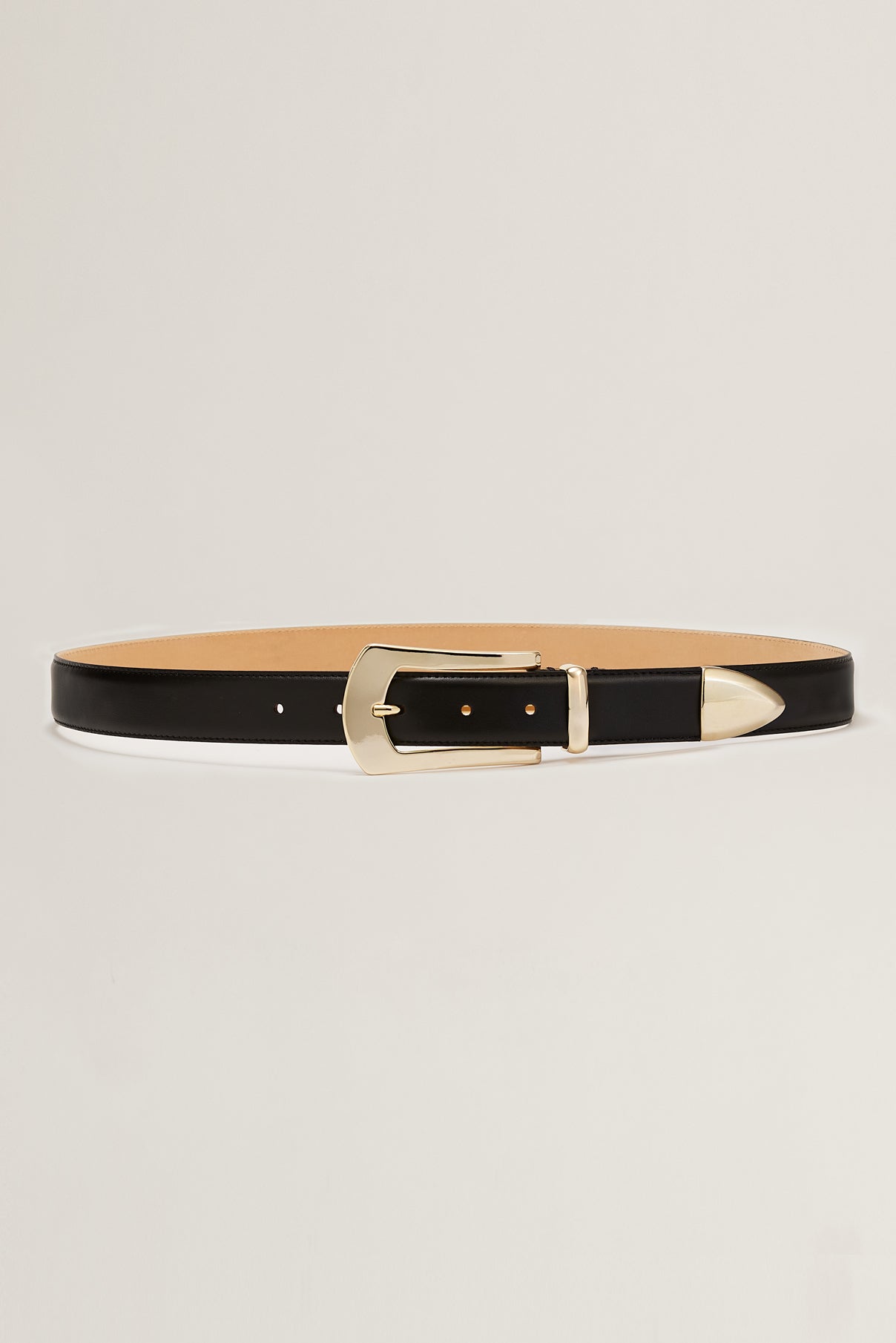 Knox smooth black leather belt displayed rolled to show gold hardware and texture.