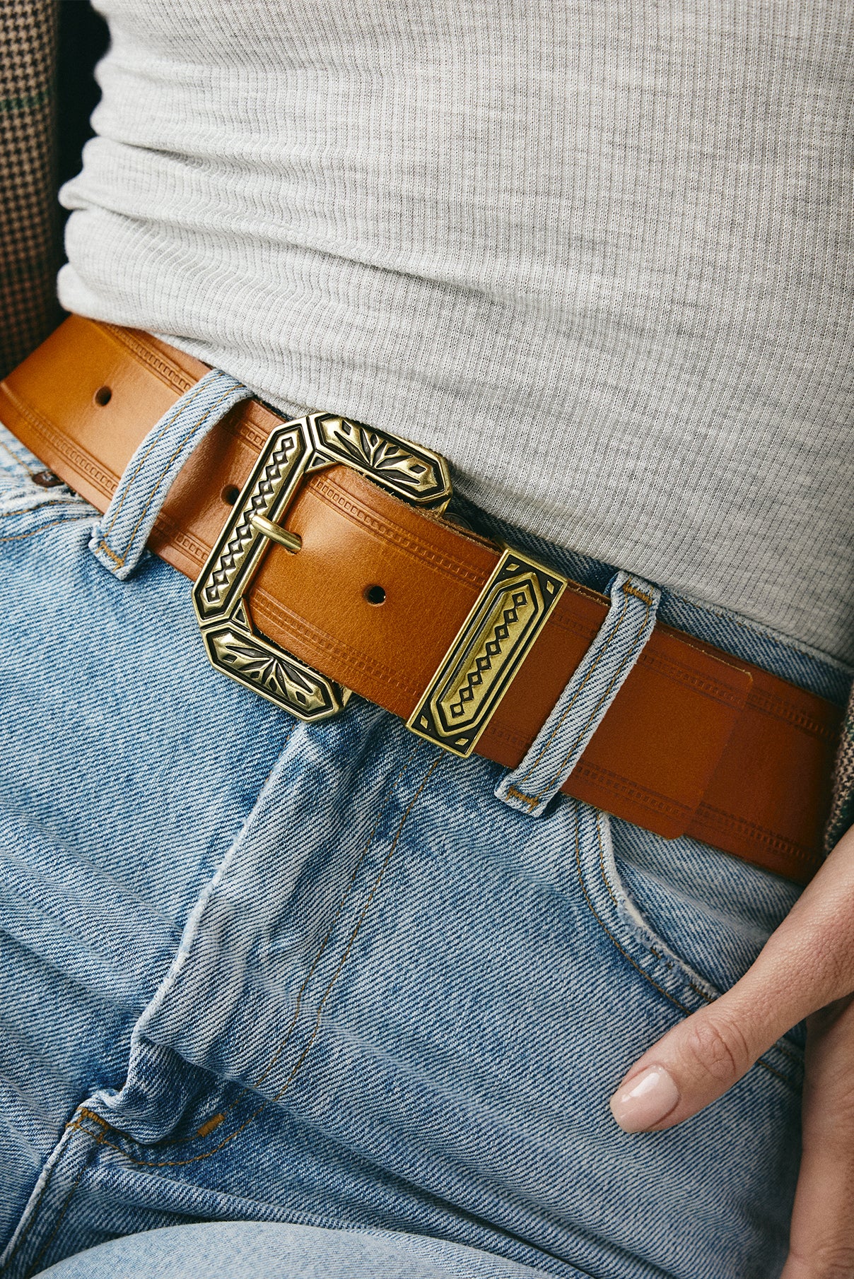Model wearing the Nola vachetta waist belt styled at the waist.