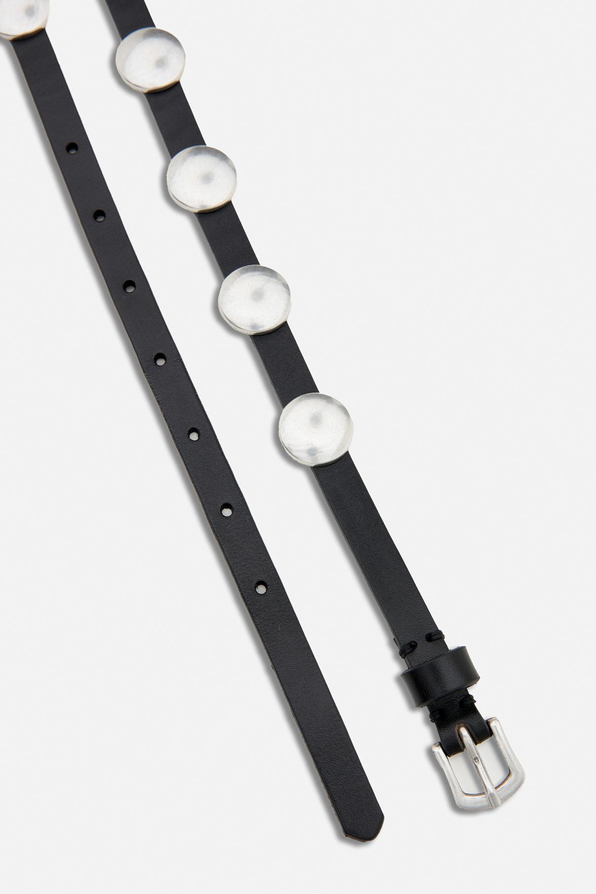 Flat lay close up of the Shai vintage black leather belt showing silver hardware.