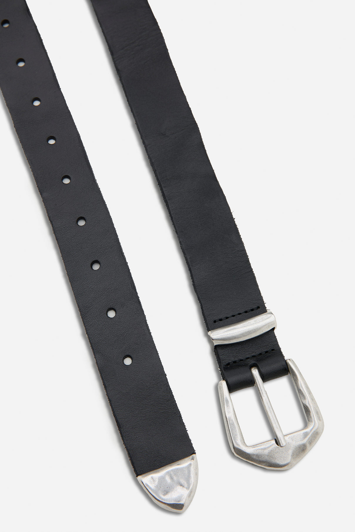 Close up flat lay of the Wren black vintage belt highlighting silver Western buckle and tip.