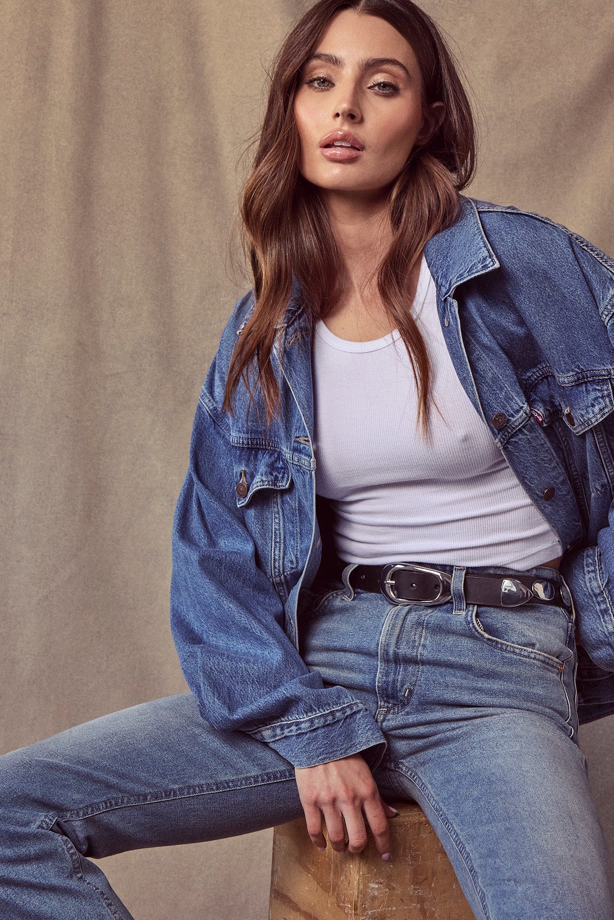 The Blake black leather belt on the model, highlighting studs and buckle detail.