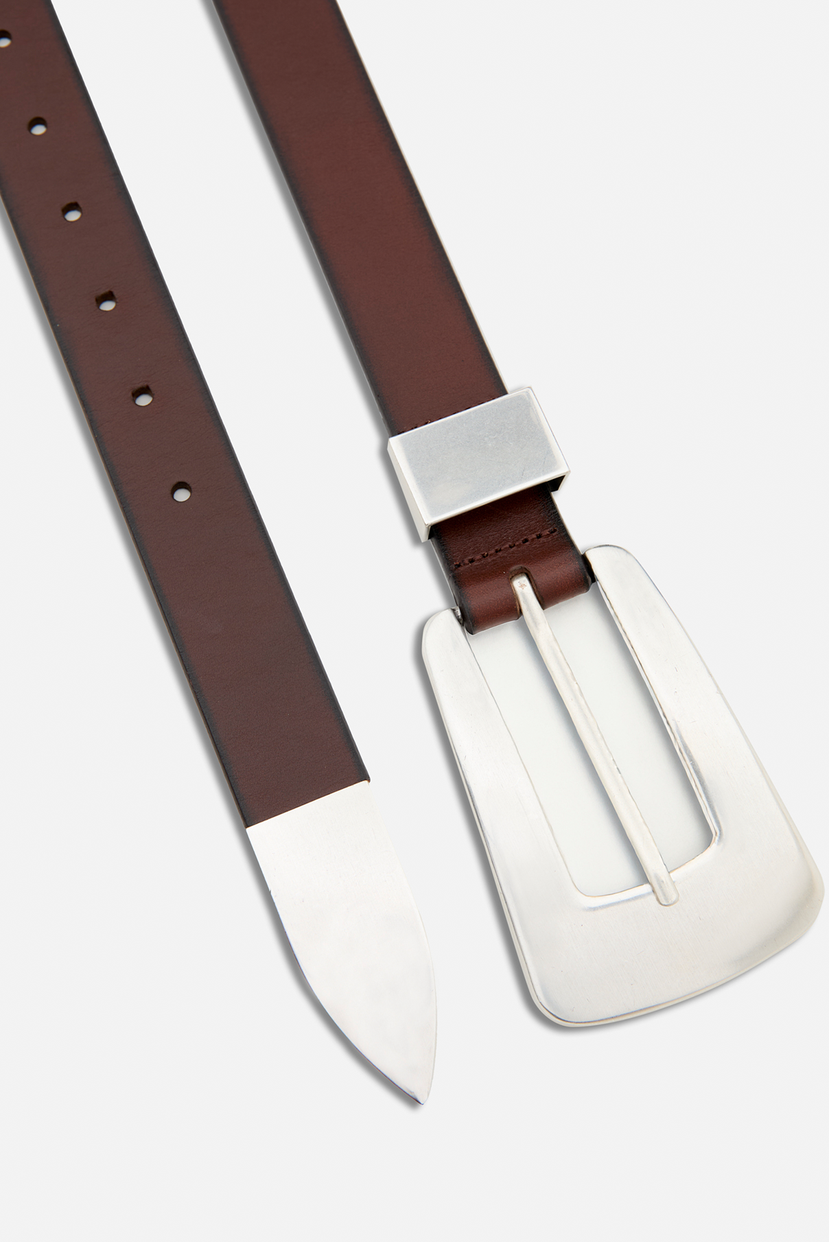 Close up flat lay of the Logan dark brown leather belt highlighting vintage silver hardware details.